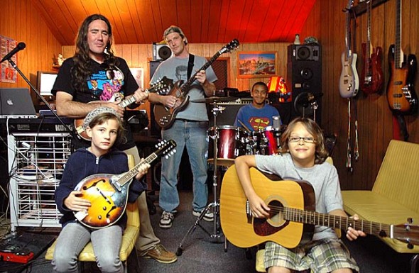 Oliver Simons and Zac Fenton started Lord of the Strings musical instruction in a studio space at MillWorks to teach children and adults how to play instruments alone and with others. Here at a recent music lesson, are, clockwise from front right, Eli Eyrich, Dorian Campbell, Simons, Fenton and Drevin Roberts. (Photo by Megan Bachman)