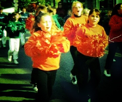 The yellow arrow indicates me, in a parade, very obviously incredulous about why this was happening to me.