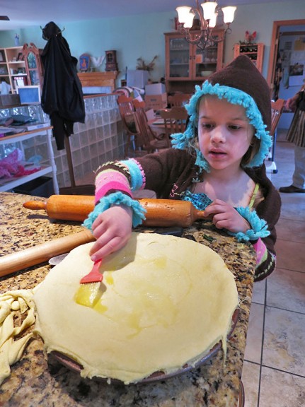 brushing Olive Oil on top
