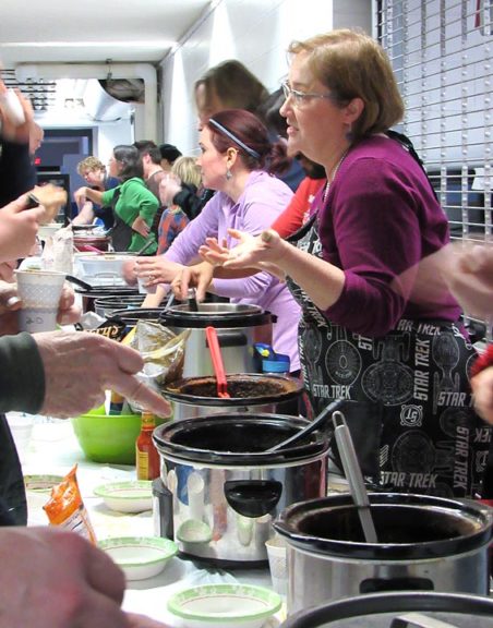 Lorrie Sparrow-Knapp, right, served up one of the 20 chilis on offer at last year’s McKinney chili cook-off, an annual fundraiser for the eighth-grade trip to Washington, D.C. This year’s cook-off is Saturday, Feb. 17, and includes a barn dance. (Submitted photo by Maria Booth)