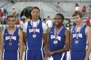 The Yellow Springs High School 4x200 relay team of, from left, Logan Norris-Sayres, Chris Johnson, Mario Cosey and Josh Meadows, earned medals for their eighth-place performance in the Div. III state meet at Ohio State over the weekend. Cosey also received a medal for finishing fifth in the 100 dash. (Photo by Nick Dudukovich)