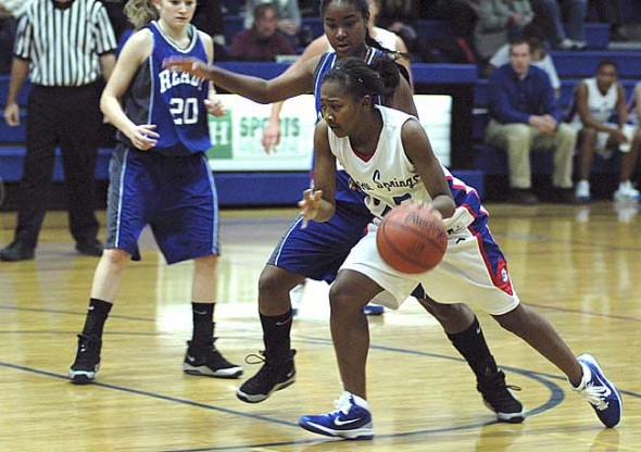 Freshman guard Brianna Ayers dribbled past a Bishop Ready defender on her way to the hoop during the team’s 46–27 loss last week. Ayers had four points during the game. (Photo by Megan Bachman) 