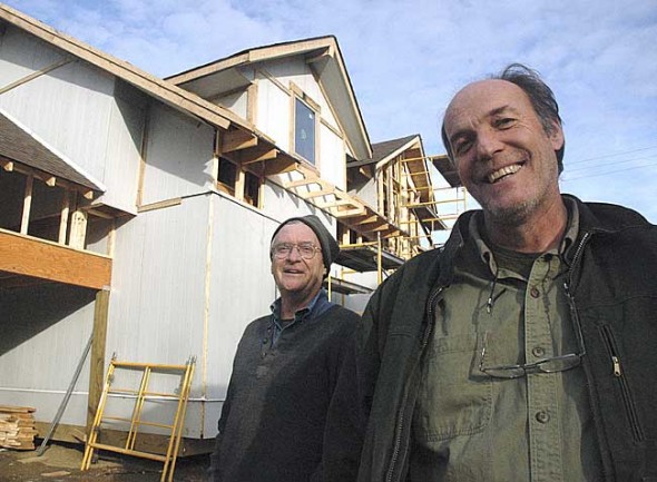 Jonathan Brown, left, and Roy Eastman are building three passive houses in the Thistle Creek development. The passive house uses a variety of energy-efficient building techniques, including double-thick walls to retain heat. (Photo by Megan Bachman)