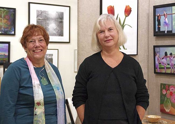 Gayle Sultzbach (left) and Christine Klinger opened Springs Gallery in Kings Yard this spring, featuring art by local and regional artists, as well as some of their own work. (Photo by Sehvilla Mann)