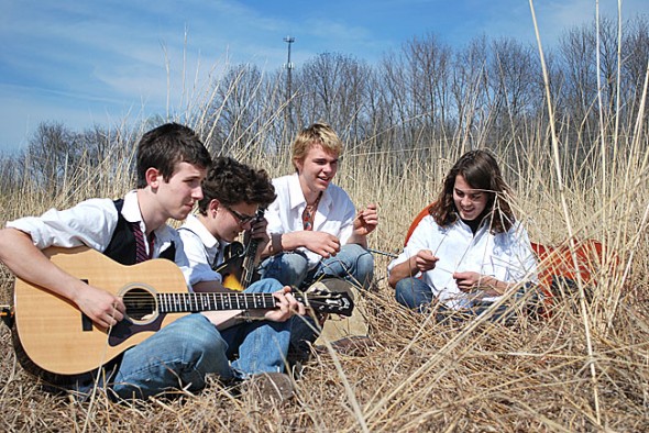 Wheels members Rory Papania, left and Sam Salazar, second from left, met at Friends Music Camp in 2009. Now the band, which also includes Friends Music Camp alums Jamie Scott and Sam Crawford, right, along with Connor Stratton (not pictured), will perform at a benefit concert for Friends Music Camp’s scholarship fund on Friday, Dec. 30, at 7:30 p.m. at the Yellow Springs Senior Center. (Submitted photo by Savanah Amos)