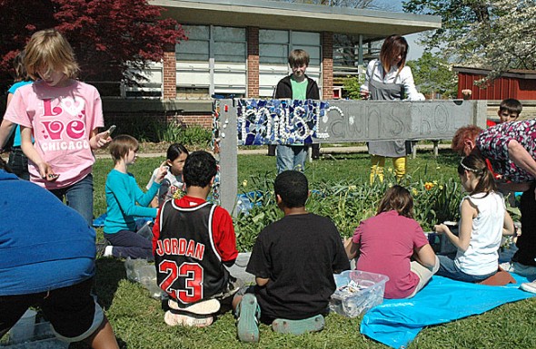 Mounting the Mills Lawn School mosaic project. (Photos by Matt Minde) 