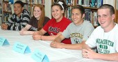 YSHS senior athletes going on to play in college are, from left, Antone Truss (track), Elizabeth Malone (swimming), Erika Chick (swimming), Jacob Trumbull (soccer) and Jake Fugate (football). Not pictured is Greg Felder Jr. (basketball). (Photo by Megan Bachman)