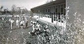 Students were ecstatic to be out on the golf course side of the the new Antioch School around when it was built in 1953. The school will celebrate its 90th anniversary with an open house reunion on Saturday, July 7, noon–4 p.m. at the school. (Photo courtesy of Antiochiana, Antioch College)
