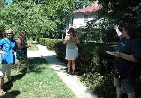 Historian Robin Heise is shown at right talking about the historic Octagon House at a recent walking tour. Heise hopes that villagers will contribute stories about local history to her Web site at ysheritage.org.
