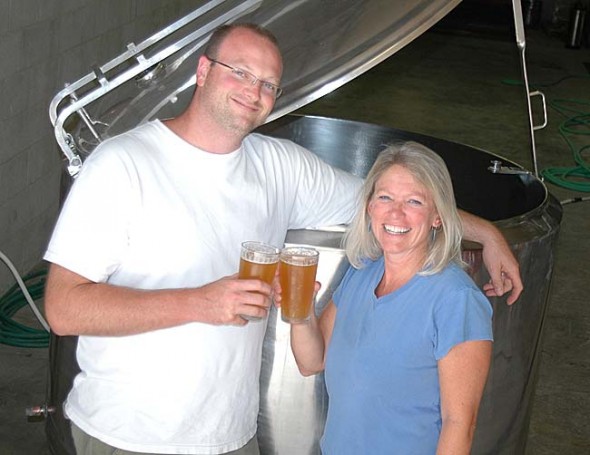 Local beer-lovers Nate Cornett and Lisa Wolters toasted to their new business venture, Yellow Springs Brewery, which is set to begin brewing and serving craft beer at its MillWorks location by year’s end. (Photo by Megan Bachman)