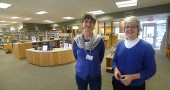 Librarians Ann Cooper, left, and Connie Collett helped design the new layout of the Yellow Springs Community Library, which recently underwent a major renovation. The more spacious lobby area seen behind them will promote better flow, while the new HVAC equipment, windows and doors may keep the 50-year-old building in good shape for another 50 years. (Photo by Megan Bachman)