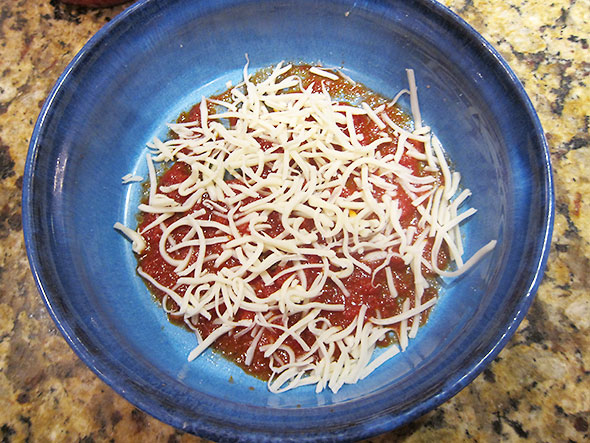 bottom Layer of tomato sauce and cheese