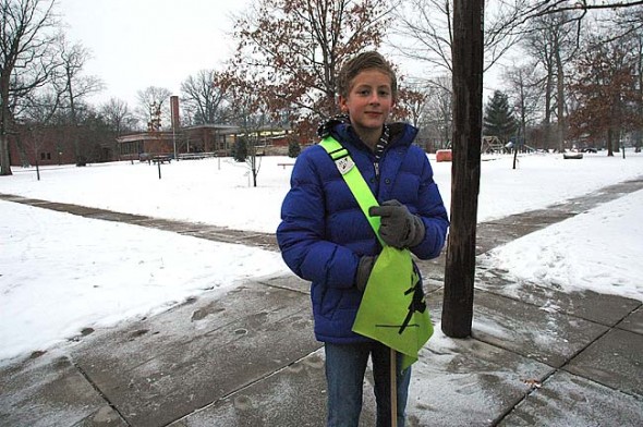 Mills Lawn sixth grade student Teymour Fultz helped youth cross safely to school this week, as parents, teachers and the wider community continue to discuss the security needs for the local school district. (Photo by Lauren Heaton)