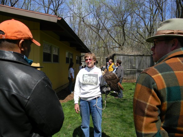 Raptor Center Director Betty Ross introduces a resident red-tailed hawk to attendees at the Earth Day celebration on Sunday, April 21.
