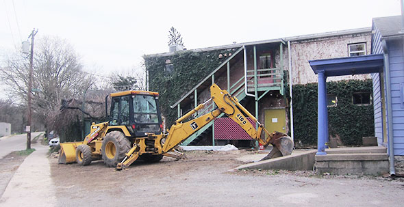 excavator prepares new patio area