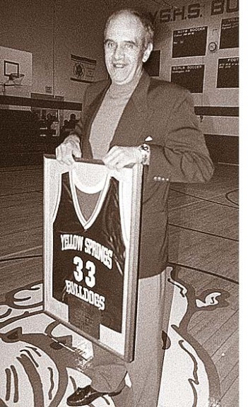 Local basketball legend Charlie Coles, a celebrated basketball coach at Miami University, died last week. Coles was honored at Yellow Springs High School in 2000 with the retiring of his jersey #33. He broke records in single-game and season scoring while at Bryan High School in the late 1950s and led the 1972 YSHS boys team to a district title. (Photo from the News Archives)