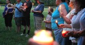 White and black neighbors came together for a silent candlelight vigil on Sunday night for Trayvon Martin, the 17-year-old African-American victim of a fatal shooting in Florida. (Photo by Megan Bachman)