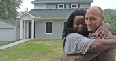 Brett and Isis Henderson will soon close on a house on West Davis Street built by local affordable housing group Home, Inc. The Hendersons hope to raise a family in the three-bedroom house, which was built to use about half the energy of a conventional home. (Photo by Megan Bachman)