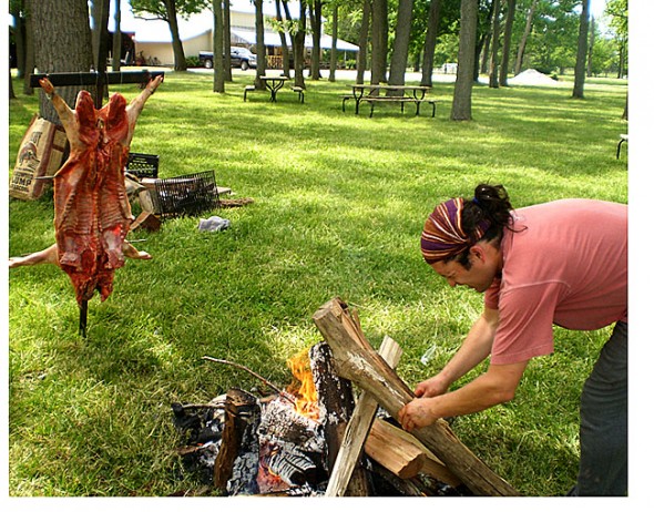 La Pampa Grill chef Mariano Rios prepares to roast a local pig at Peifer Orchards.