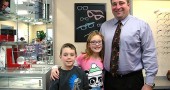 Optometrist Todd McManus, pictured above with his children, Gavin, 7, and Haley, 10, recently opened a new office at the south end of Yellow Springs. He also practices in Xenia with a satellite office in Enon. (Photo by Carol Simmons)