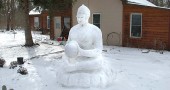 Chris Glaser's snow buddha sits patiently and at peace in the cold, as only the buddha could do. (Photo by Megan Bachman)