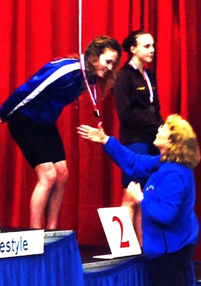 YSHS freshman Olivia Chick accepted a medal for her second-place finish in the 100-yard freestyle at the Southwest Ohio Division II District Championships, held at Miami University on Feb. 14. Chick swam the race in 51.25 seconds, a new school record and good enough to qualify her for this weekend’s state meet. Chick also qualified in the 200-yard freestyle. (Submitted photo)