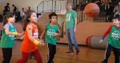 Players scrambled for a loose ball at a Yellow Springs Bulldog Youth Basketball League game last Saturday. From left, Julianna Torres, Mateen Sajabi, referee Matt Housh and Collin Calfee. (Photo by Megan Bachman)