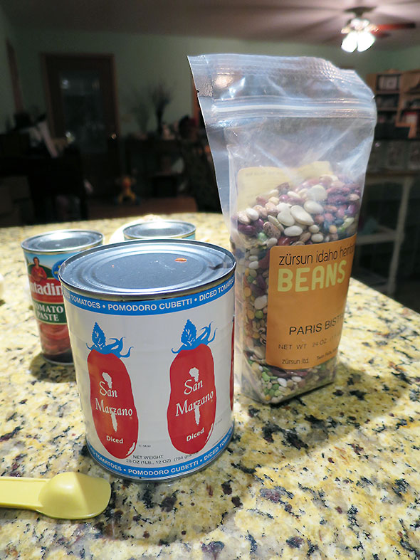 bag of beans and canned tomatoes