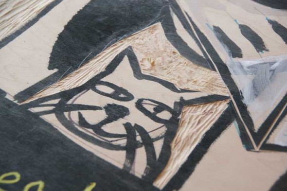 A close up of Sherraid Scott's cat in the center of her board that she's carving as part of the Fence Art Gallery. (photos by Suzanne Szempruch)