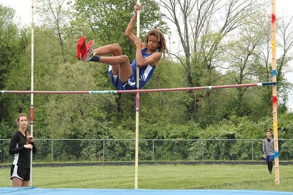 YSHS track and field star Oluka Okia leaped over the pole vault bar during the Metro Buckeye Conference championships at Yellow Springs High School on May 17. Okia went on to win the conference title in the high jump (5’8’’) to help propel the YSHS boys team to a second-place finish. The girls team also came in second. The track season ended this week. (Photo by Megan Bachman)
