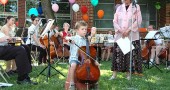 Shirley Mullins' youngest student, Quentin Branlat, 6, played a measured and tonal “Twinkle Twinkle Little Star” on a quarter size cello while staring straight at his audience the entire performance. (photos by Lauren Heaton)