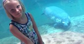 Mackenzie Horton, 9, recently asked friends and family to forego birthday gifts and instead make donations to help save manatees. She raised $160 so far and hopes to raise $200 by mid-August. Mackenzie is shown at the Columbus Zoo with her favorite marine mammal. (Submitted Photo)