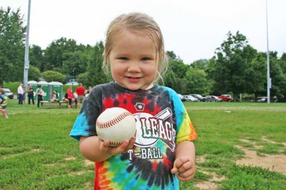 Sophia Purdin, age 3,  proudly showed off one of the many baseballs she chased at last week's T-ball. (Photos by Suzanne Szempruch)