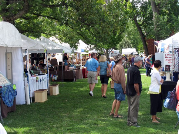 Visitors stroll the grounds at Mills Lawn during the annual "Art on the Lawn" art and craft show. (Submitted photo)