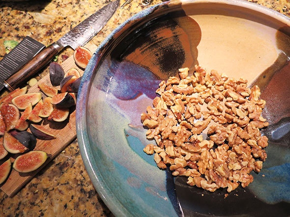 toss cut fruit Into toasted nuts