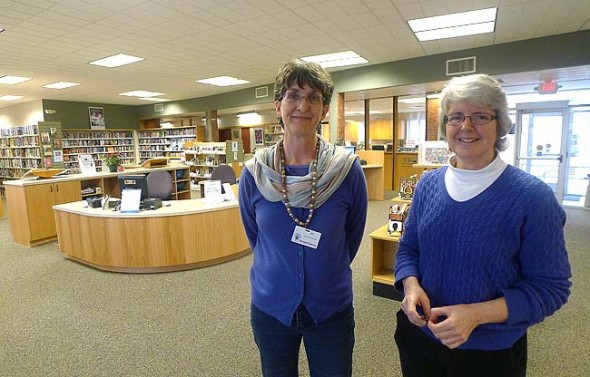 The library levy renewal that Issue 2 puts forth will be the first time in a decade that library leaders have asked for more money. Pictured above are librarians Ann Cooper, left, and Connie Collett, who helped design the new layout of the Yellow Springs Community Library renovation in January, 2013. (News Archive Photo by Megan Bachman)