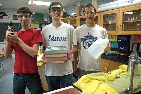 (photo bSeniors Ben Ihrig, Dylan Boczar and Sam Crawford in chemistry safety gear. (photo by Lauren Heaton)y Lauren Heaton)