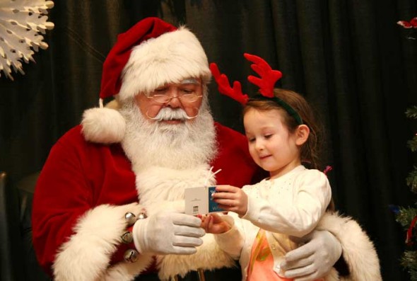 Santa and Mrs. Claus can to the Glen building on Sat. Dec. 13. Nika Nelson, age 4, shared with Santa her wish list this year, a Frozen ice castle and a pink dress. (Photos by Suzanne Szempruch)