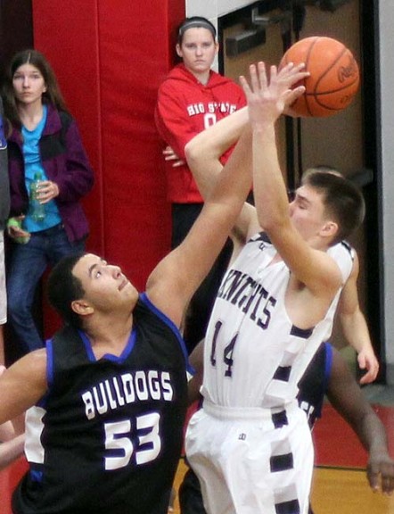 Isaiah Taylor went up to block a Greenon player during the YSHS boys basketball team’s 70–35 away victory on Dec. 22. Taylor scored nine in the contest in which every Bulldog player made the scoresheet. (Submitted photo by Jimmy DeLong)