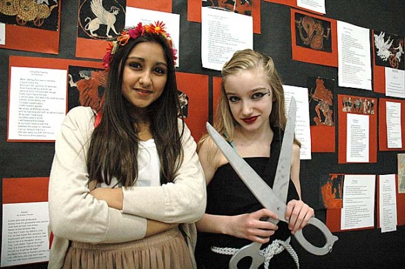 At the district’s project-based learning exhibition night in February 2014, McKinney Middle School students Ischel Heredia, left, and Anastasia Cooper presented the seventh-grade’s Ancient Greece project. The district’s third K-12 PBL exhibition night will take place Thursday, Jan. 15, 6:30–8 p.m. at Mills Lawn School, featuring a wide variety of projects such as a French cookbook, ecosystem exploration and a performance of “Antigone.” (News archive photo by Matt Minde)