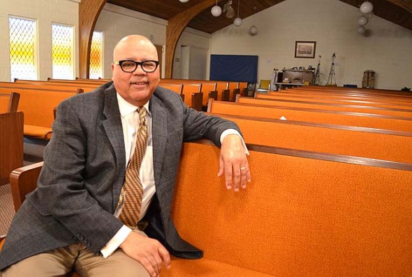 The Reverend Dwight Smith is the new pastor at the historic Central Chapel AME Church, a local congregation founded in 1866. Smith, who lives in Dayton, was a television news broadcaster before answering the call to ­ministry.  (Photo by Megan Bachman)