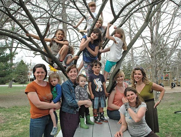 These moms and kids, along with the rest of their families, are among those who will attend Tar Hollow on May 17–19. Pictured on the Mills Lawn playground are, from left in front, Eden Matteson with Violet; Victoria Rowe with Ainslie; Matteo Basora; Corrie Van Ausdal; Karla Horvath; and Alice Basora. In the tree are, from left clockwise, Carina Basora; Tiger Jane Collins (top); Jack Horvath; Hayley Rowe; Ashlea Rowe; and, turning away, Teddy Horvath. (Photo by Diane Chiddister)
