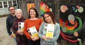 The Yellow Springs Arts Council published a Yellow Springs Artist Directory this month, after over a year’s work from the board and, from left, Nick Gaskins, Jane Baker, Holly Underwood and Alex Scott. The approximately 270 artists in the book can pick up a complimentary copy, also available to the public for $2, at the YSAC Gallery on Corry Street. (Photo by Lauren Heaton)