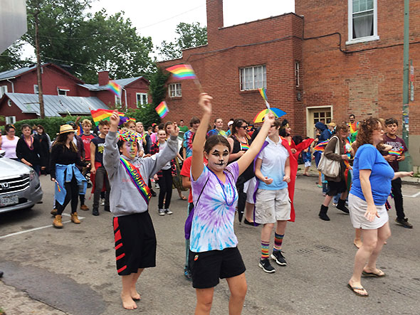 Participants in the pride parade perform the cupid shuffle