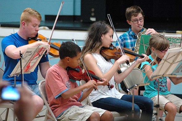 Students and teachers alike perform last Friday, July 10, in the Yellow Springs Summer Music Camp orchestra. Pictured above are, from left, teacher Alex Moore, Antonio Chaiten, Sophie Hannes, Sean Adams and Adeline McKay. (Photos by Matt Minde)