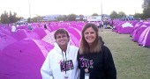 Village Manager Patti Bates, a four-time cancer survivor, is training for a three-day, 60-mile walk she’ll make in November as part of the annual Susan G. Komen for the Cure fundraiser. She’s shown here at her first three-day event several years ago, with her friend Lois McNight. (Submitted photo)
