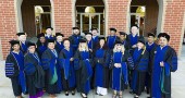 Shown above are 20 members of Antioch University’s Ph.D. in Leadership and Change Class of 2015, shown at AU Midwest following their Aug. 1 commencement. Altogether, the group included 23 graduates from 14 states and three countries. (Submitted Photo by Andy Snow )