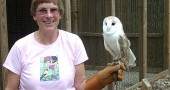Betty Ross with one of the Raptor Center’s permanent residents, a barn owl named Louie. Barn owls are not native to Ohio, but moved in after the forests were cleared for farming. After nearly 30 years as the Raptor Center’s director, Ross retired last month. (Photo by Audrey Hackett)