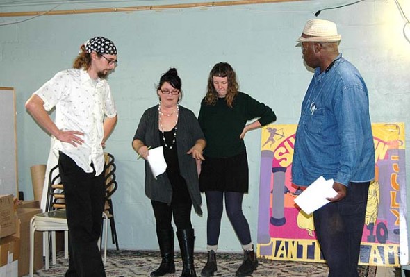 Miriam Eckenrode Saari (second from the left) directs cast members (from left) Coltin Pitstick, Anna Carlson and Bomani Moyenda in rehearsal for the allegorical play “Catch the Next Bus,” to be presented as part of the annual 10-Minute Plays Festival, which opens this weekend, Oct. 16–17, and continues next weekend, Oct. 23–24, at First Presbyterian Church. “Catch the Next Bus” will be featured during the festival’s second weekend. (photo by Carol Simmons)