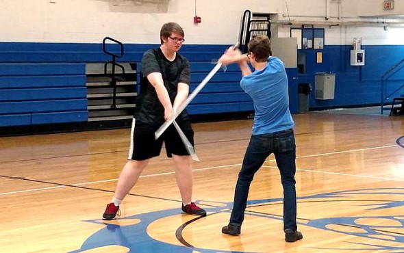 Duard Headley (Macbeth) and Nicolas “Bear” Wright (Macduff) vie for the throne in YSHS’s production of “Macbeth.” The actors engaged in professional stage combat training and Shakespeare reading workshops to immerse themselves more fully in the performance. “‘Macbeth’ is not meant to be read; it’s meant to be played,” said the play’s director Lorrie Sparrow-Knapp. ‘The Scottish play’ opens Oct. 30 at 8 p.m. at Mills Lawn Elementary School gym. (Photo by Dylan Taylor-Lehman)
